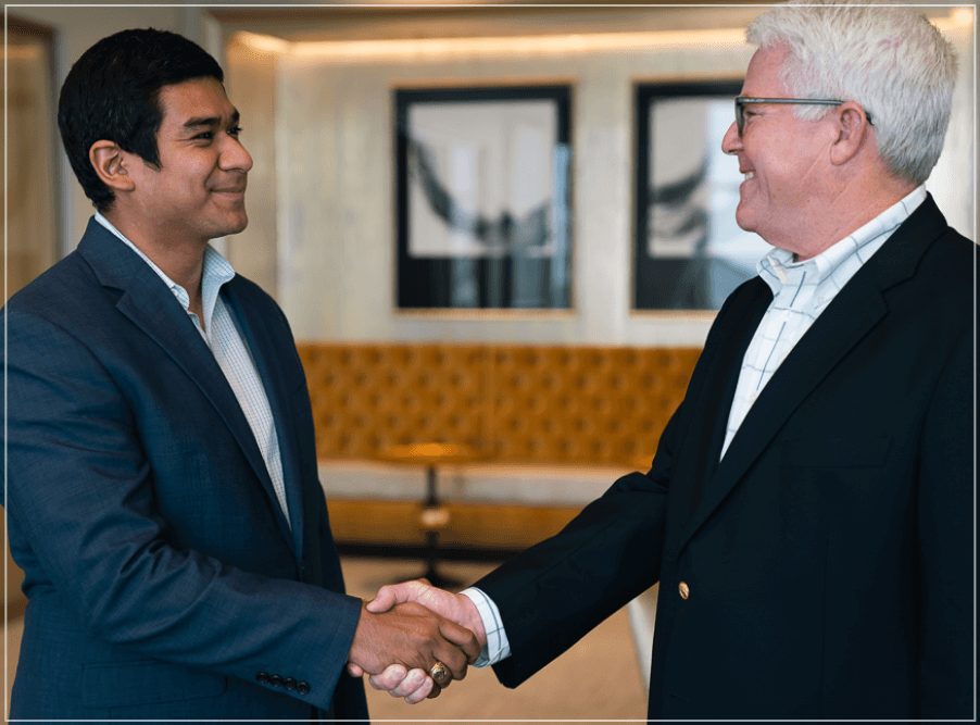 Evercap advisor shaking hands with a business owner